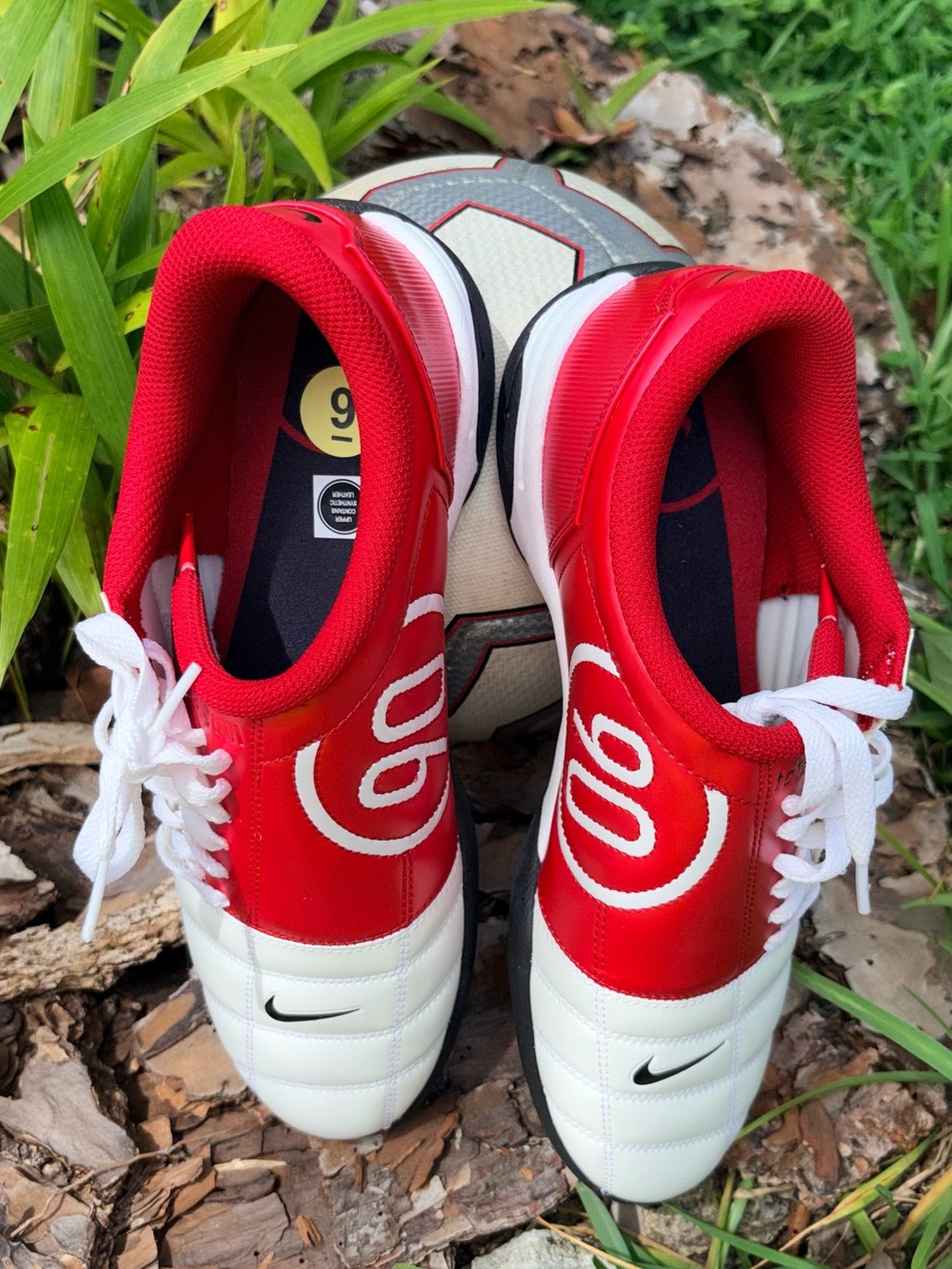 Nike Red and White Football Cleats with Black Swoosh